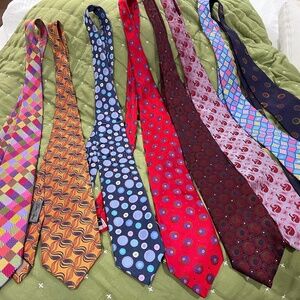 A collection of eight 100% silk mens neckties
